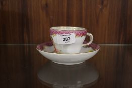 A CONTINENTAL PICTORIAL CUP AND SAUCER WITH CROSSED SWORDS MARK TO BASE