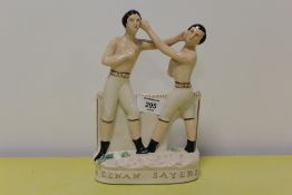 A STAFFORDSHIRE FLATBACK STYLE FIGURE OF TWO BOXERS 'HEENAN SAYERS'