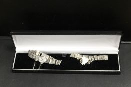 A HALLMARKED SILVER GATE BRACELET ROTARY WRISTWATCH, TOGETHER WITH A MATCHING BRACELET (2)
