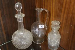 A CUT GLASS BANDED NECK DECANTER AND ANOTHER TOGETHER WITH A GLASS EWER (3)