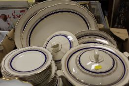 A TRAY OF ROYAL DOULTON CREAM BLUE AND GILT DINNERWARE