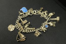 A SILVER CHARM BRACELET AND CHARMS - APPROX WEIGHT 46.38 G