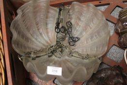 AN ART DECO SHELL SHAPED FROSTED GLASS CEILING SHADE