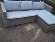 A GARDEN FURNITURE RATTAN CORNER SOFA