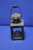 AN ANTIQUE RAILWAY LAMP