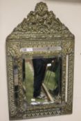 A DECORATIVE GILT MIRROR