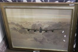 A FRAMED AND GLAZED PRINT OF A LANCASTER BOMBER