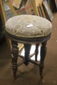 AN ANTIQUE BOBBIN LEGGED SWIVEL TOP PIANO STOOL