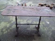 AN ANTIQUE CAST IRON TABLE