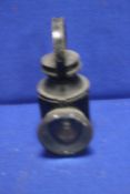 AN ANTIQUE RAILWAY LAMP