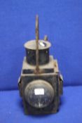 AN ANTIQUE RAILWAY LAMP