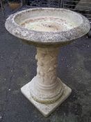 A RECONSTITUTED STONE BIRD BATH