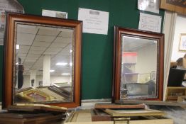 A PAIR OF FRAMED MIRRORS 107 CM X 63 CM