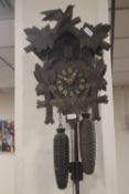 A CARVED WOOD CUCKOO CLOCK A/F