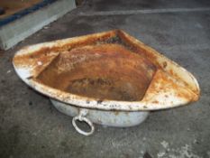 AN ANTIQUE CAST IRON CORNER SINK GARDEN PLANTER