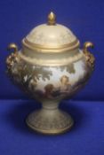 A PAINTED LIDDED TWIN HANDLED URN