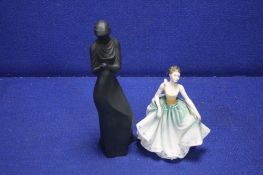 A ROYAL DOULTON FIGURINE 