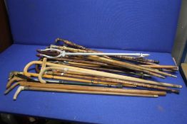 A COLLECTION OF ASSORTED WALKING STICKS TO INCLUDE SILVER TOPPED EXAMPLES