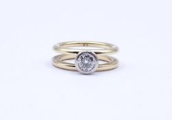 585er bicolor Goldring mit Brillant von ca. 0,70ct., (mit Einschlüssen), 9,50g., RG 55/56
