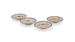 A SET OF FOUR GEORGE III SILVER PARCEL GILT COUNTER DISHES, THOMAS ROBINS