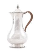 AN EDWARDIAN SILVER BALUSTER COFFEE JUG, HOLLAND