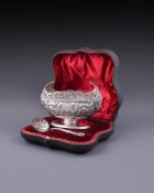 AN EDWARDIAN SILVER OVAL PEDESTAL SUGAR BOWL AND SIFTING SPOON, JOSIAH WILLIAMS & CO