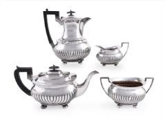 A LATE VICTORIAN SILVER OBLONG BALUSTER FOUR PIECE TEA SERVICE, COOPER BROTHERS