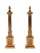 A pair of gilt metal columnar table lamps