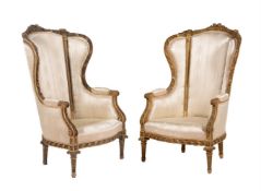 A pair of carved giltwood and upholstered armchairs in Louis XVI style