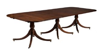 A mahogany three-pillar dinning table in George III style