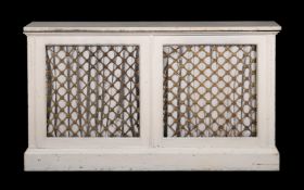A cream painted and marble topped side cabinet in Regency style