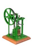 A well-engineered model of an over-type vertical live steam mill engine