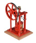 A well-engineered model of an over-type vertical live steam mill engine