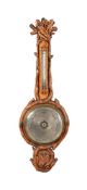 AN UNUSUAL VICTORIAN CARVED OAK MERCURY WHEEL BAROMETER