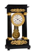 A FRENCH LOUIS PHILIPPE ORMOLU MOUNTED EBONISED PORTICO MANTEL CLOCK