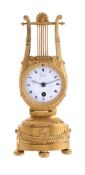 A FRENCH EMPIRE SMALL ORMOLU LYRE-SHAPED MANTEL TIMEPIECE