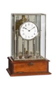 A FINE ENGLISH NICKEL-PLATED BRASS AND MAHOGANY ELECTRIC TABLE CLOCK