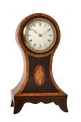 AN EDWARDIAN INLAID MAHOGANY BALLOON-SHAPED MANTEL TIMEPIECE