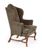 A QUEEN ANNE WALNUT WING ARMCHAIR, CIRCA 1710
