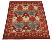 A WOVEN CARPET, IN THE MANNER OF DESIGNS BY C.F.A. VOYSEY, approximately 309 x 248cm