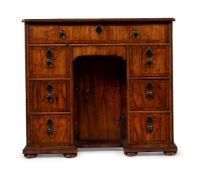 A GEORGE I WALNUT KNEEHOLE DESK, CIRCA 1720