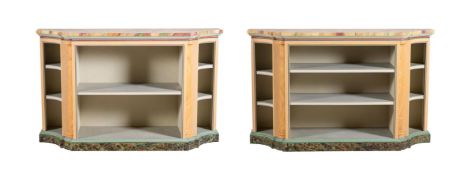 A PAIR OF PAINTED AND SIMULATED OPEN BOOKCASES