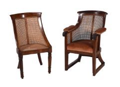 TWO MAHOGANY LIBRARY ARMCHAIRS