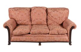A MAHOGANY AND UPHOLSTERED BERGERE SOFA