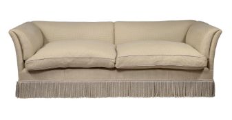A LARGE MAHOGANY AND UPHOLSTERED SOFA IN THE MANNER OF HOWARD & SONS