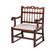 A GEORGE III MAHOGANY SPINDLE BACK ARMCHAIR