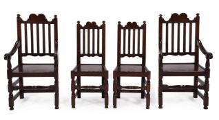 A SET OF EIGHT STAINED OAK DINING CHAIRS IN EARLY 18TH CENTURY STYLE