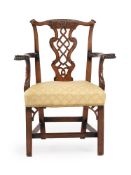 A GEORGE III CARVED MAHOGANY ARMCHAIR