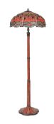 A MODERN PATINATED METAL AND COMPOSITION STANDARD LAMP IN THE TIFFANY STYLE