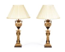 A PAIR OF BRONZE AND GILT LAMPS IN NEOCLASSICAL TASTE